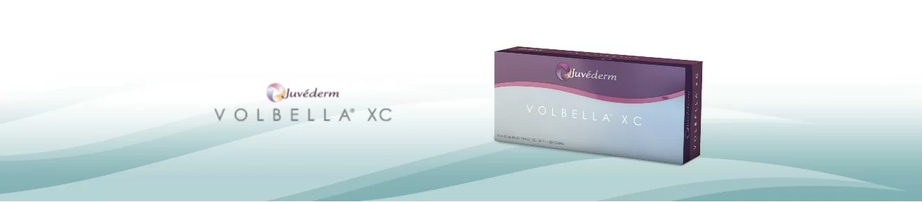 A minimalist promotional image featuring a box of volbella xc, a dermal filler product from the juvederm family, set against a soothing blue gradient background.