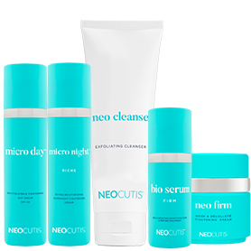 A collection of neocutis skincare products, featuring day and night creams, an exfoliating cleanser, a bio serum, and a firming cream.
