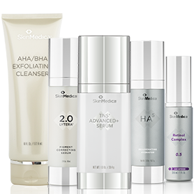 A collection of premium skincare products displayed against a neutral background, featuring a cleanser, serums, and a retinol complex for a comprehensive skincare regimen.